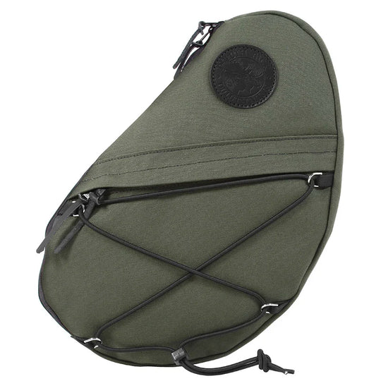 Sling Pack in Olive Drab featuring durable handmade canvas, external pocket, and adjustable bungee cords, designed for rugged outdoor use by Duluth Pack.