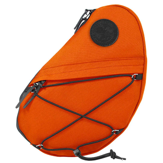 Sling Pack in vibrant orange features durable handmade canvas with a practical front zipper pocket and elastic cords, ideal for outdoor adventures by Duluth Pack.