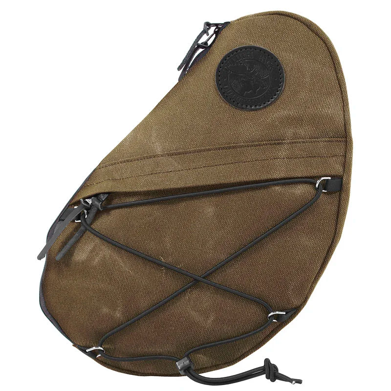 Sling Pack in waxed khaki canvas with leather accents, handmade for rugged outdoor use, featuring exterior pocket and adjustable cord for versatile carry.