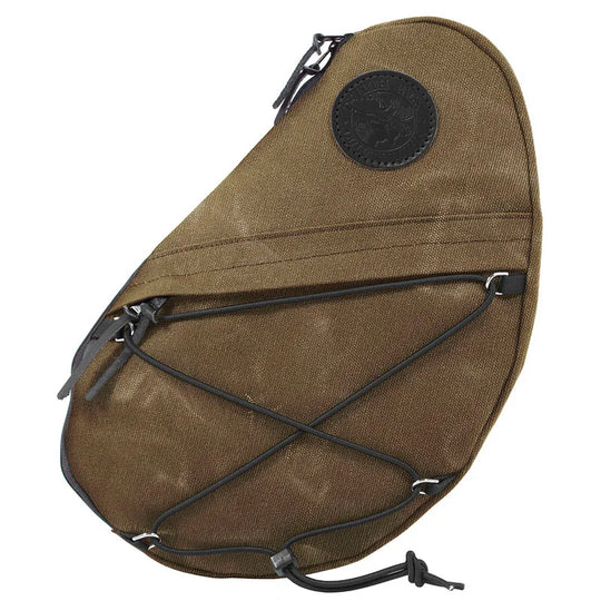 Sling Pack in waxed khaki canvas with leather accents, handmade for rugged outdoor use, featuring exterior pocket and adjustable cord for versatile carry.