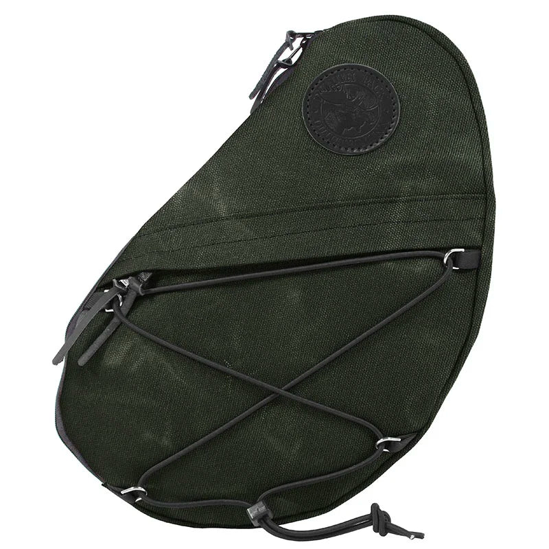 Sling Pack in Olive Drab with durable waxed canvas construction, featuring adjustable bungee cords and a zippered external pocket, designed for rugged outdoor use.