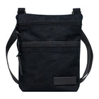 Superior Series Canvas Traverse Crossbody in black canvas with dual zippered compartments and adjustable cotton web shoulder strap, designed for everyday use and travel.