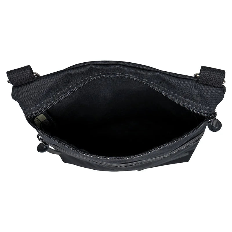 Superior Series Canvas Traverse Crossbody in black canvas with cotton web shoulder strap, open top showing spacious interior for everyday and travel use