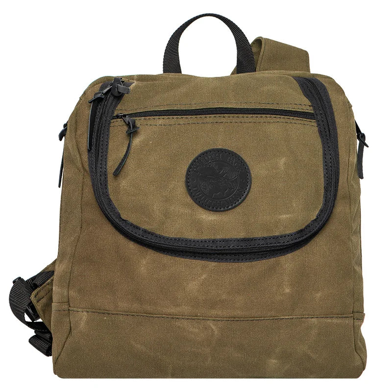 Blind Bag in waxed khaki canvas with black accents, designed for rugged outdoor use and functional hunting gear by Duluth Pack.