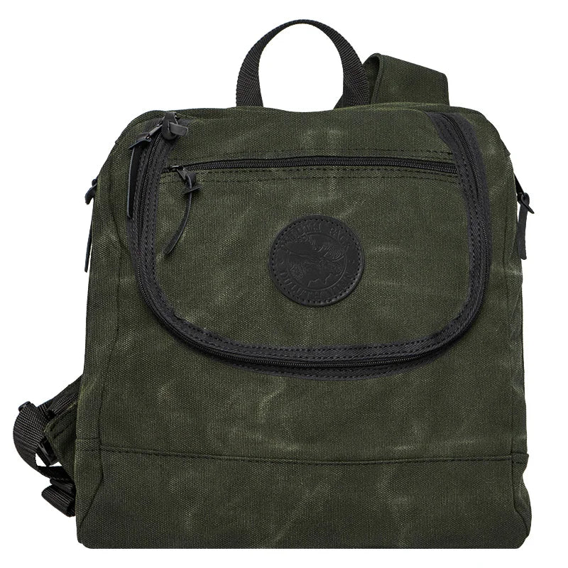 Blind Bag in Waxed Olive Drab featuring rugged canvas construction and multiple zipper pockets, designed for durable outdoor use and functional hunting gear.