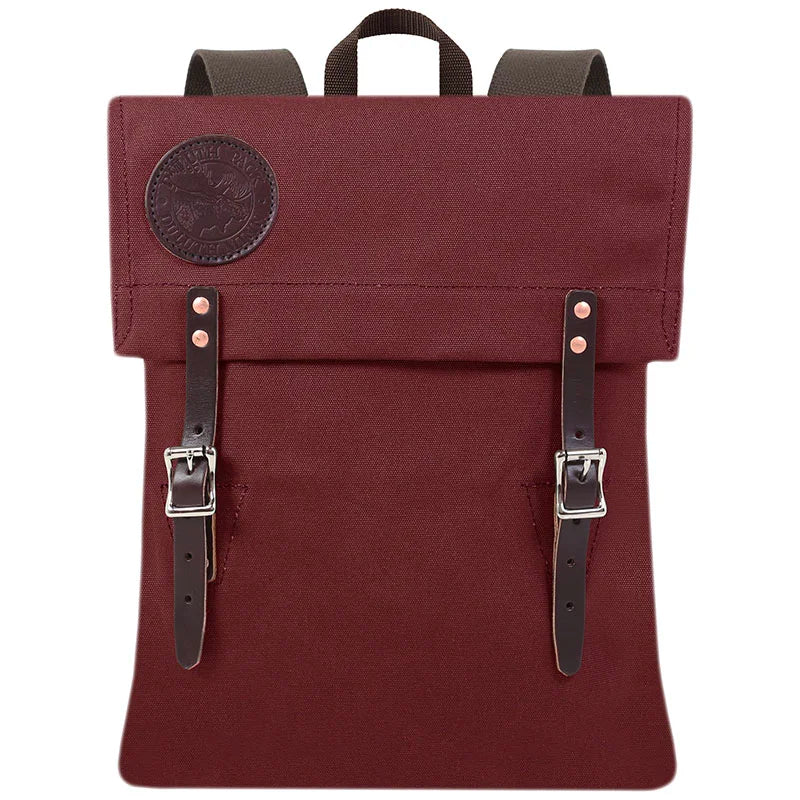Scout Pack in burgundy canvas with leather straps, handmade for durable outdoor use and heritage style by Duluth Pack.