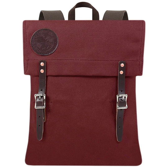 Scout Pack in burgundy canvas with leather straps, handmade for durable outdoor use and heritage style by Duluth Pack.