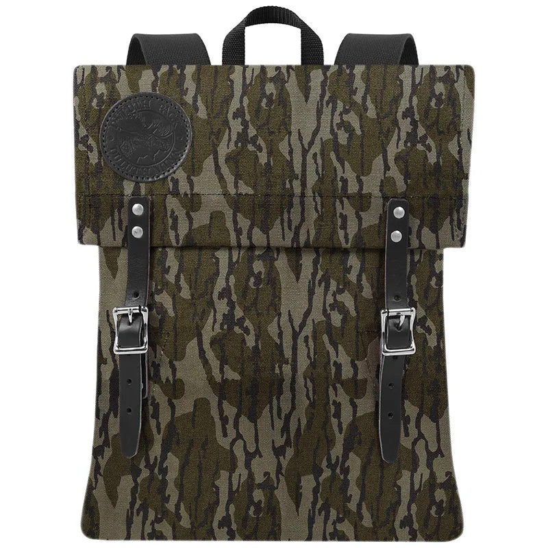 Scout Pack in Mossy Oak Bottomland Camo featuring handcrafted canvas and leather straps, designed for rugged outdoor use and lasting durability.
