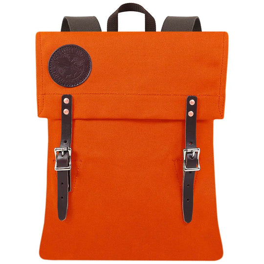 Scout Pack in vibrant orange with sturdy leather straps and durable canvas, designed for rugged outdoor use and heritage craftsmanship by Duluth Pack.