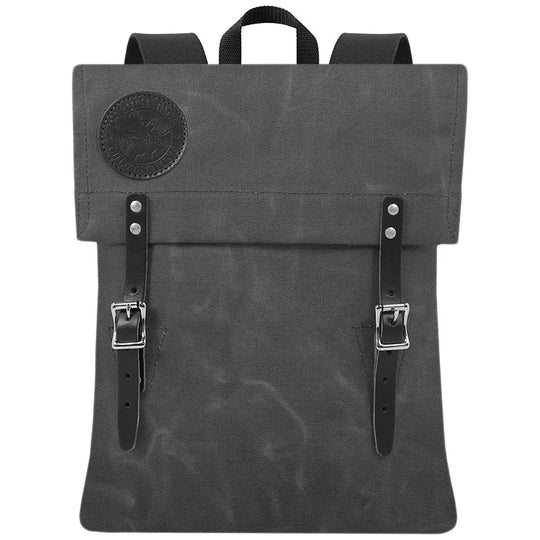Scout Pack in waxed grey canvas with leather straps by Duluth Pack, showcasing durable handmade craftsmanship for rugged outdoor use and heritage style.