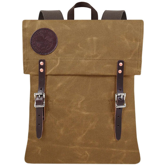 Scout Pack in waxed khaki with leather straps by Duluth Pack, showcasing rugged handmade canvas ideal for outdoor and heritage use.