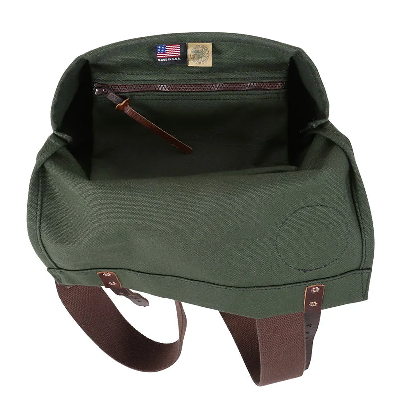 Scout Pack in Olive Drab canvas with leather accents showcasing spacious interior and durable handcrafted design ideal for outdoor use by Duluth Pack