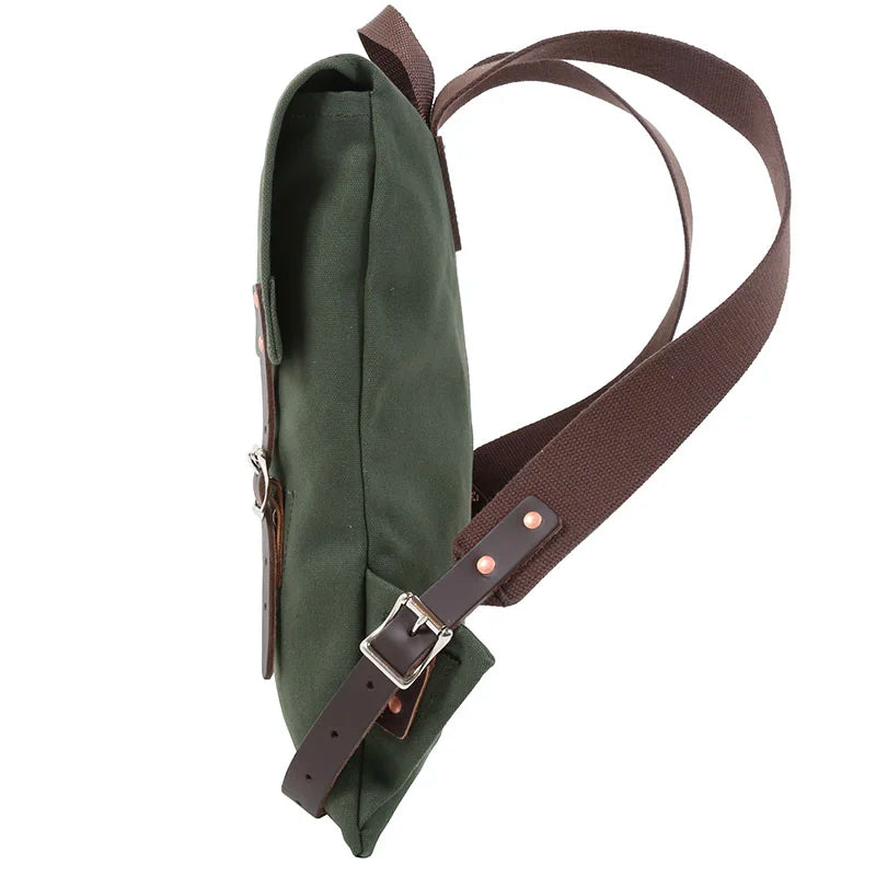 Scout Pack in Olive Drab featuring handmade canvas and leather straps, designed for durable outdoor use and rugged performance by Duluth Pack.