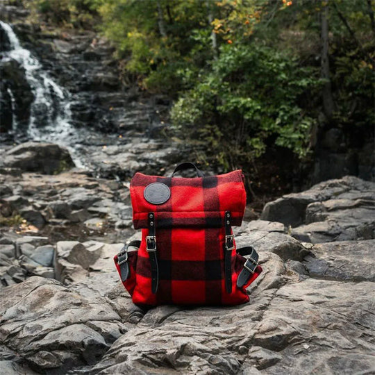 Classic Wool Scout Pack on Rock Near Waterfall