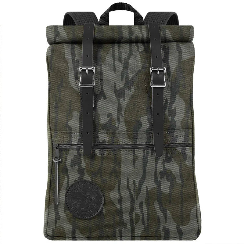 Roll-Top Scout Pack in camouflage canvas with leather straps, featuring a roll-top closure designed for versatile outdoor use and rugged durability.