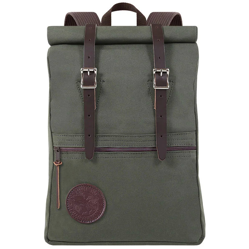 Roll-Top Scout Pack in olive green canvas with leather straps, showcasing durable handmade craftsmanship, ideal for rugged outdoor use and versatile packing.
