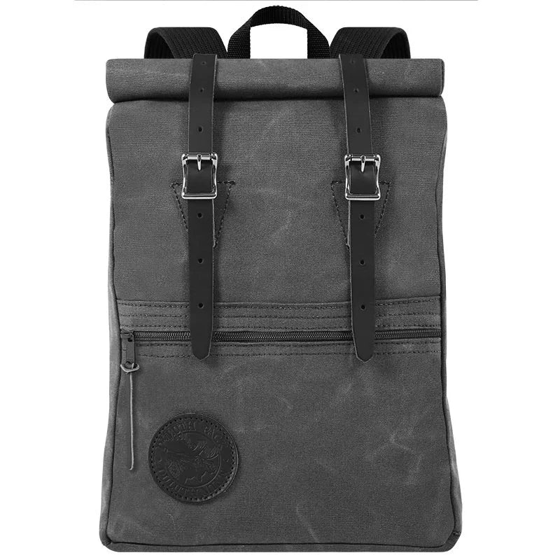 Roll-Top Scout Pack in durable waxed gray canvas with black leather straps, showcasing handcrafted quality and rugged design for versatile outdoor use.