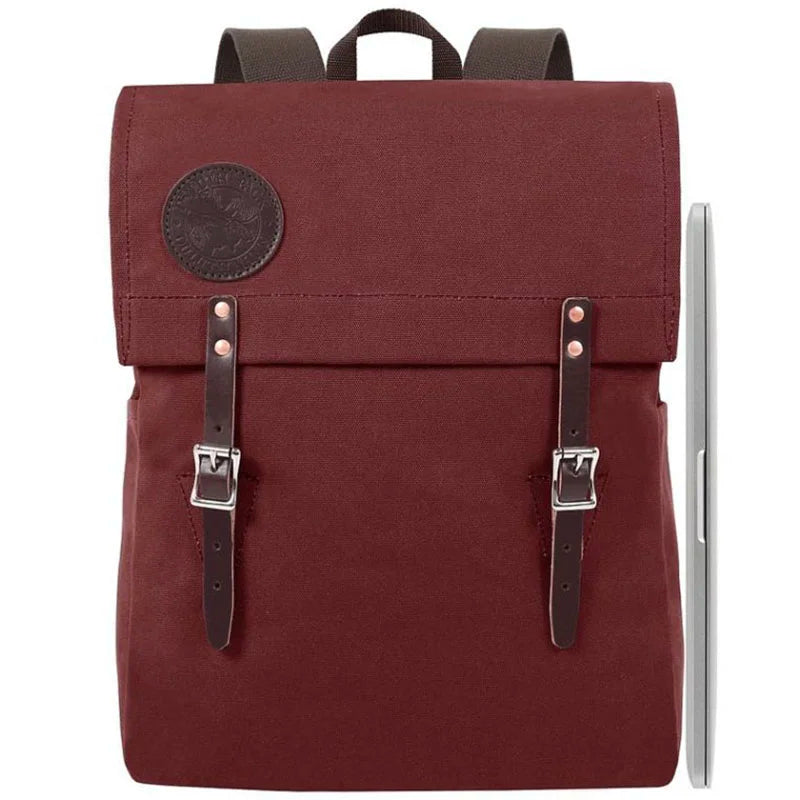 Laptop Scoutmaster in burgundy with leather straps by Duluth Pack, a durable handmade canvas backpack ideal for town and outdoor use.