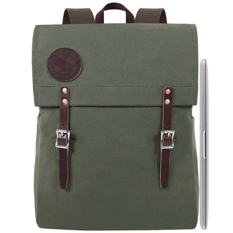 Laptop Scoutmaster in Olive Drab with leather straps by Duluth Pack, handmade canvas backpack ideal for durable, rugged outdoor and urban use.