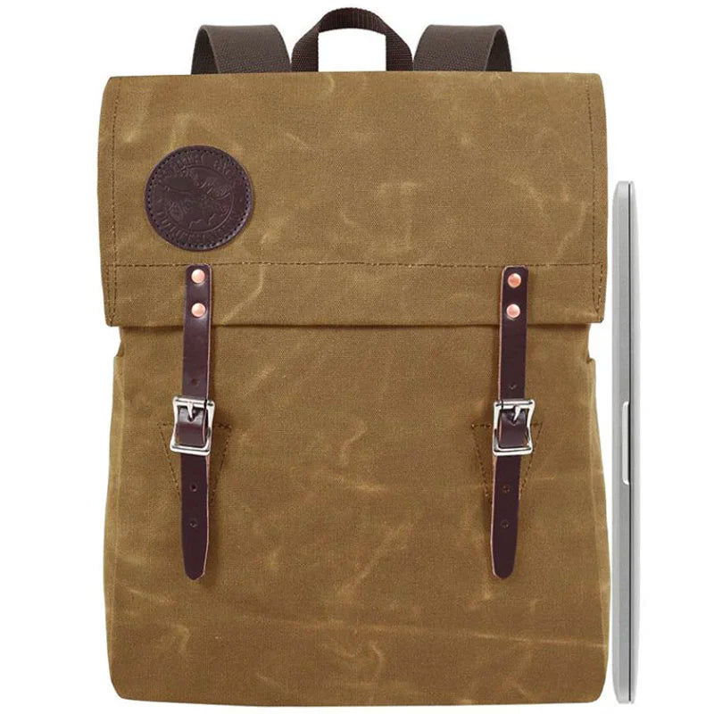 Laptop Scoutmaster in waxed khaki canvas with leather straps by Duluth Pack, a rugged and durable backpack perfect for outdoor and urban use.