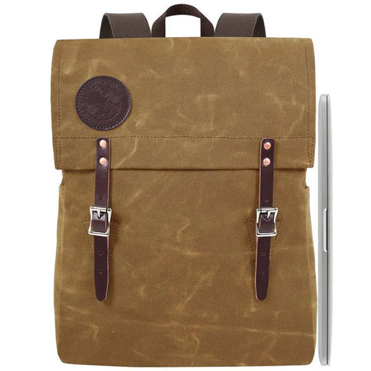 Laptop Scoutmaster in waxed khaki canvas with leather straps by Duluth Pack, a rugged and durable backpack perfect for outdoor and urban use.