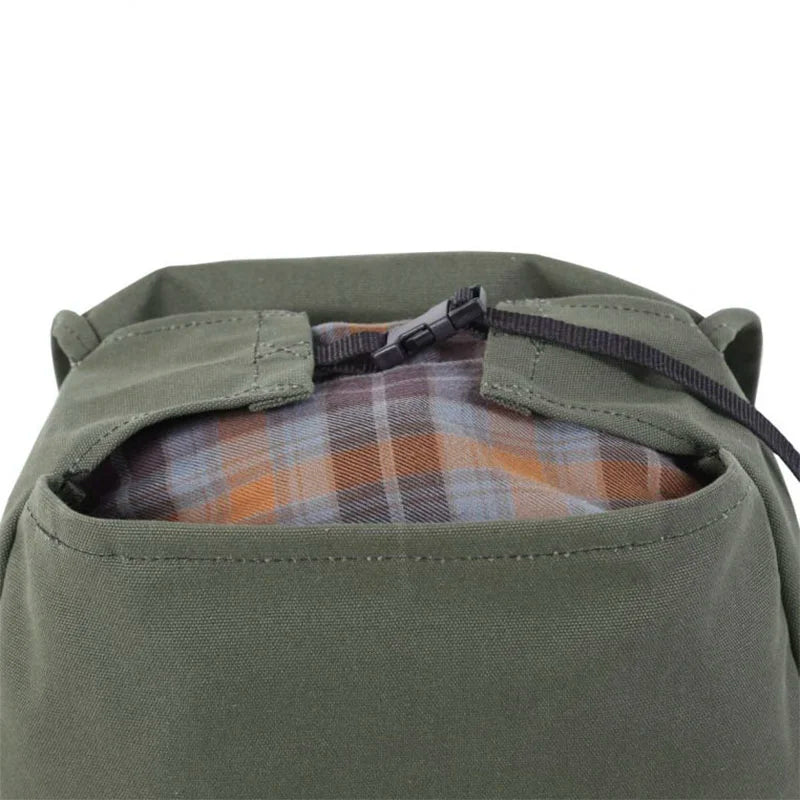 Laptop Scoutmaster in Olive Drab with durable canvas and plaid interior, showcasing rugged outdoor design by Duluth Pack ideal for town and trail use.