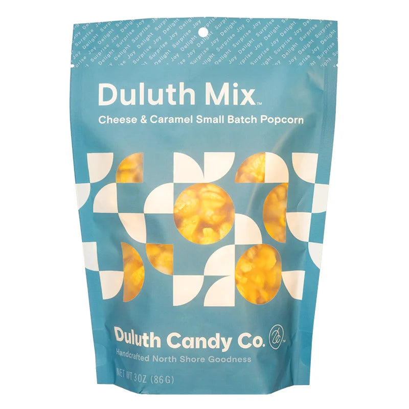 Duluth Candy Co. Popcorn Mix in Cheese &amp; Carmel with a white background