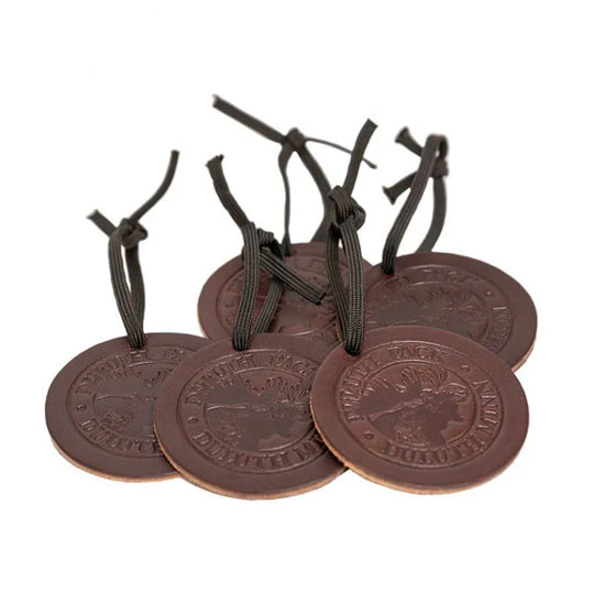 Pile of Round Leather Duluth Pack Logo Ornaments