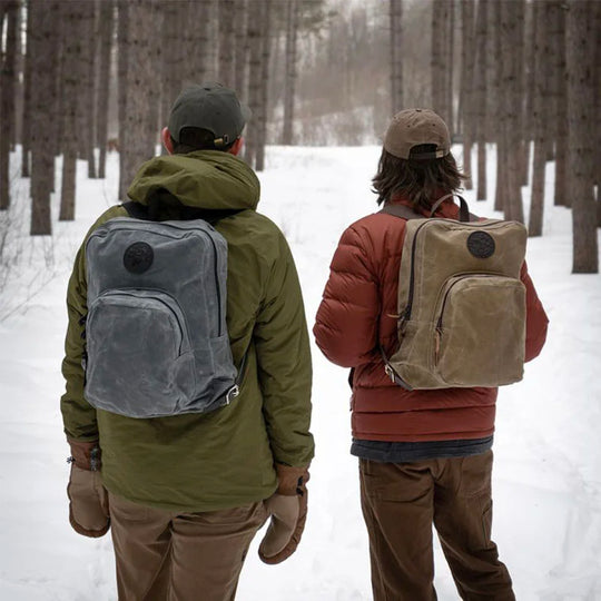 Two Large Standard Backpacks on Models in Winter