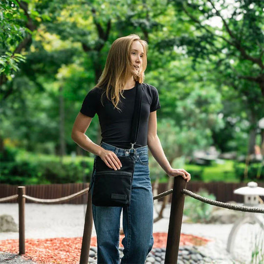 Superior Series Traverse Crossbody on Model in Park