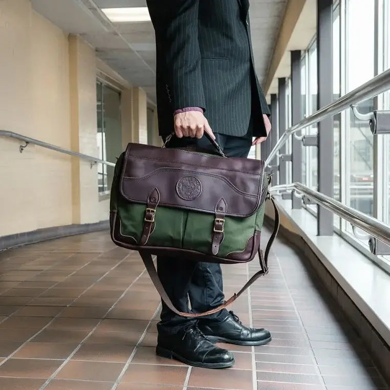 The Entrepreneur Briefcase In Olive Drab Green Being Held By A Man In A Skywalk