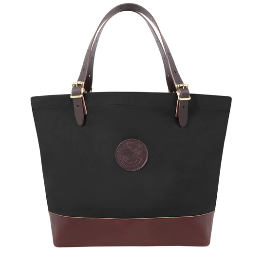 Deluxe Market Tote in black canvas with leather bottom and handles, featuring rugged construction and antique brass hardware for outdoor use and long-lasting durability.