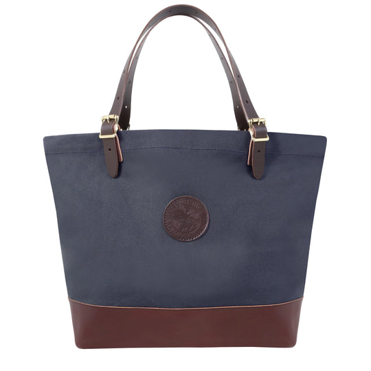 Deluxe Market Tote in navy with rugged canvas and leather handles featuring roller buckles, designed by Duluth Pack for durable outdoor use and long-lasting performance.