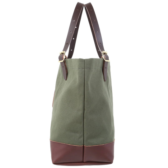 Deluxe Market Tote in olive drab with leather handles and brass hardware, crafted by Duluth Pack for durable outdoor use and rugged everyday carrying.
