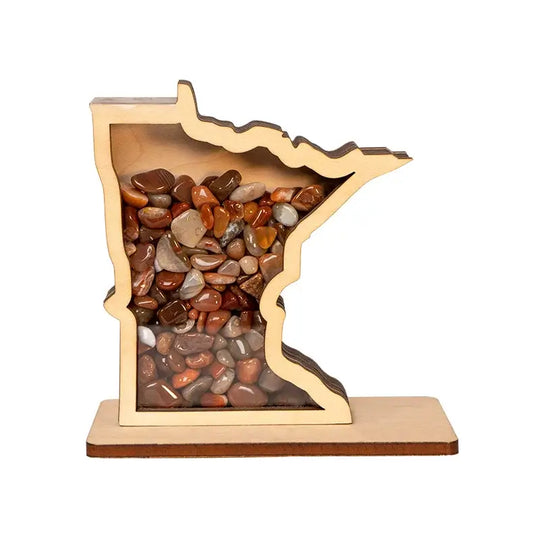 Wooden Minnesota-shaped container filled with multicolored stones on a white background