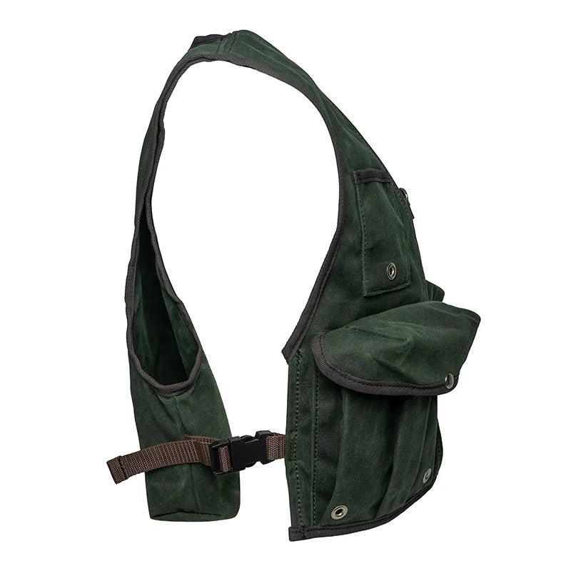 Fly Vest in dark green canvas with back mounted d-ring and secure pockets, designed by Duluth Pack for durable and accessible fly fishing gear.