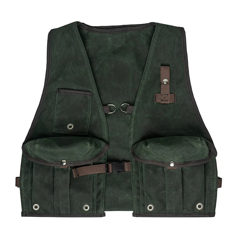 Fly Vest in dark olive waxed canvas with back mounted d-ring and multiple pockets, designed for fishing and rugged outdoor use by Duluth Pack.