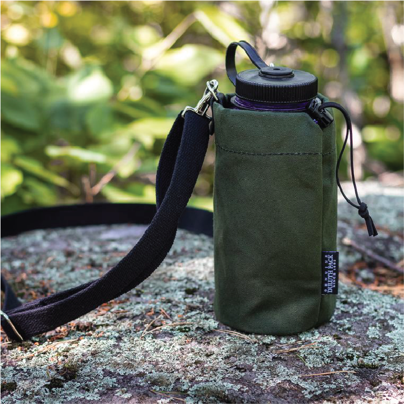 Water Bottle Holder on rock in sunny frest