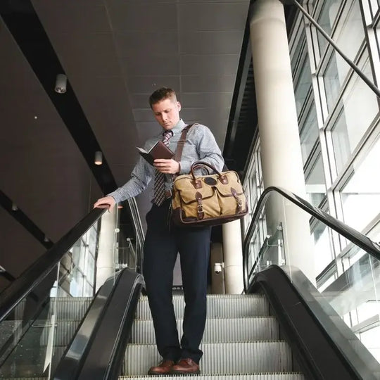 Freelance Briefcase In Waxed Khaki Being Carried by a Man On An Escalator
