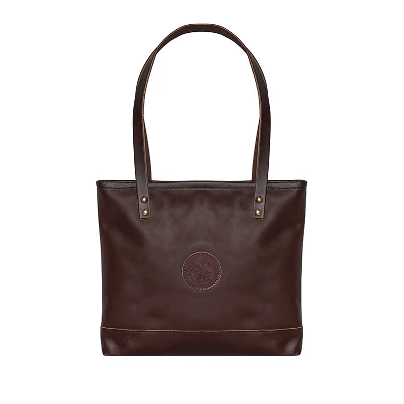 Leather Lakewalk Tote in rich brown leather with riveted handles, showcasing durable craftsmanship ideal for everyday use and outdoor adventures.