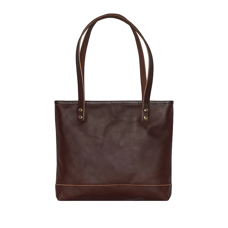 Leather Lakewalk Tote in rich brown leather with riveted handles, designed by Duluth Pack for durable, versatile everyday and outdoor use.