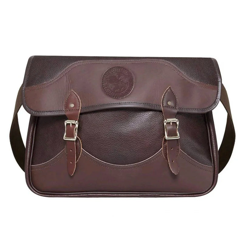 Leather Book Bag in rich brown hand-cut leather with sturdy buckle straps and cotton shoulder webbing, crafted for rugged outdoor use and lasting quality.