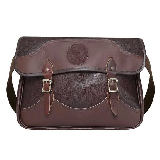 Leather Book Bag in rich brown hand-cut leather with sturdy buckle straps and cotton shoulder webbing, crafted for rugged outdoor use and lasting quality.