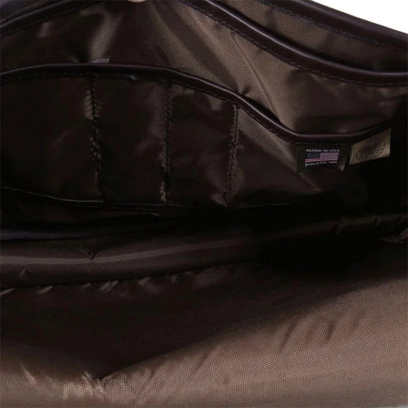Leather Book Bag interior with durable full nylon lining and organizational pockets, showcasing quality craftsmanship suited for outdoor and everyday use.