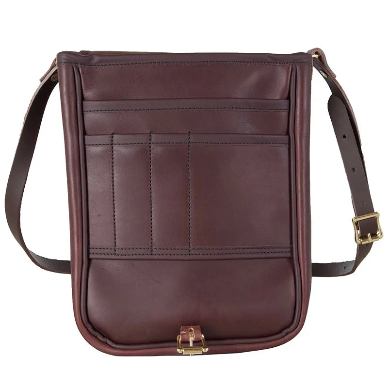 Leather Haversack in rich brown leather featuring a premium buckling closure and adjustable strap, designed for durable outdoor use by Duluth Pack.