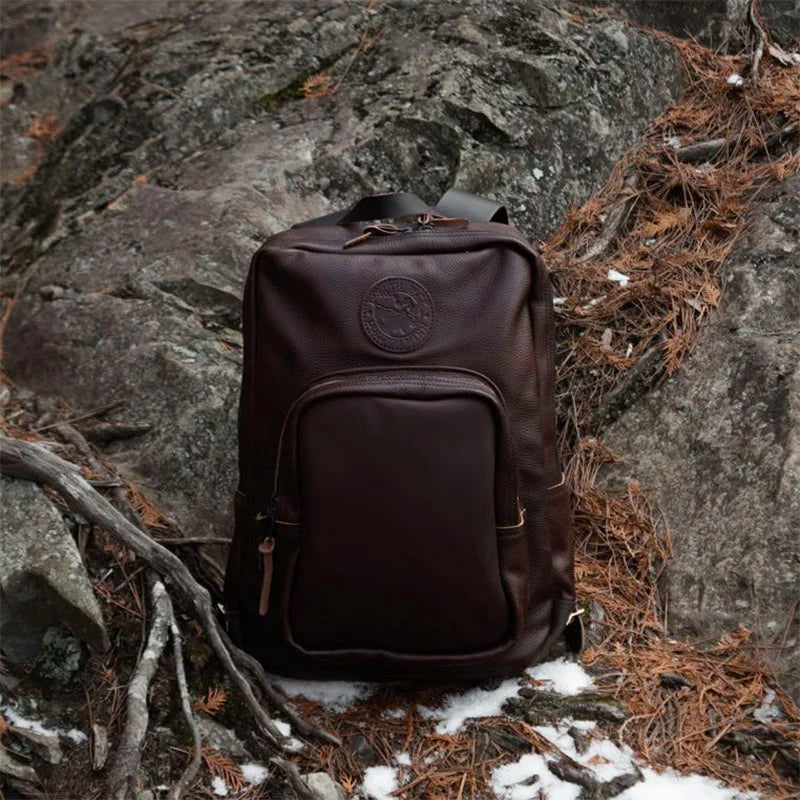 Leather Large Standard Backpack in Pebbled Brown Sitting on Rocks