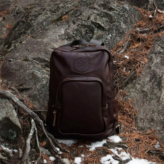 Leather Large Standard Backpack in Pebbled Brown Sitting on Rocks