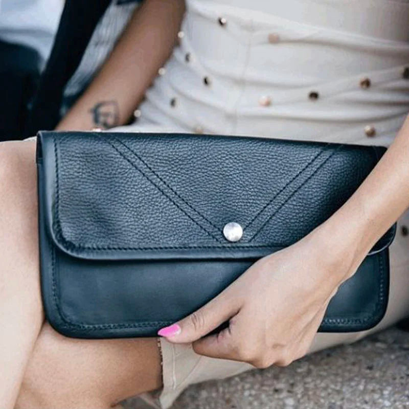 Elite Series Leather Clutch Held by Hand