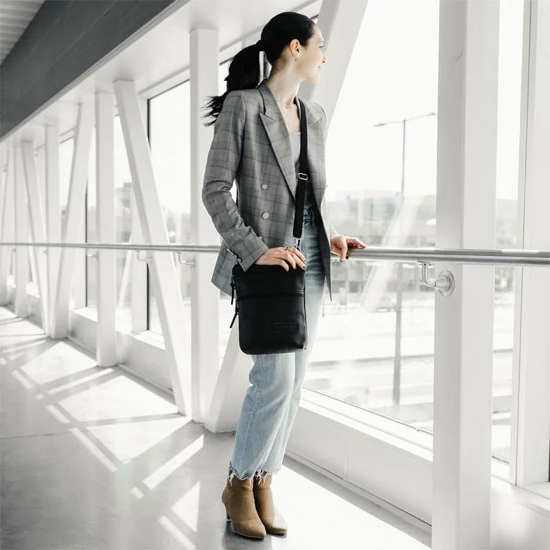 Superior Series Leather Traverse Crossbody on Woman Next to Railing