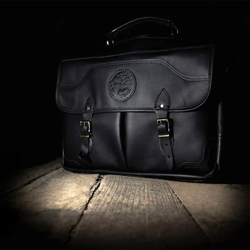 Leather Entrepreneur Briefcase on Wooden Floor with Spotlight